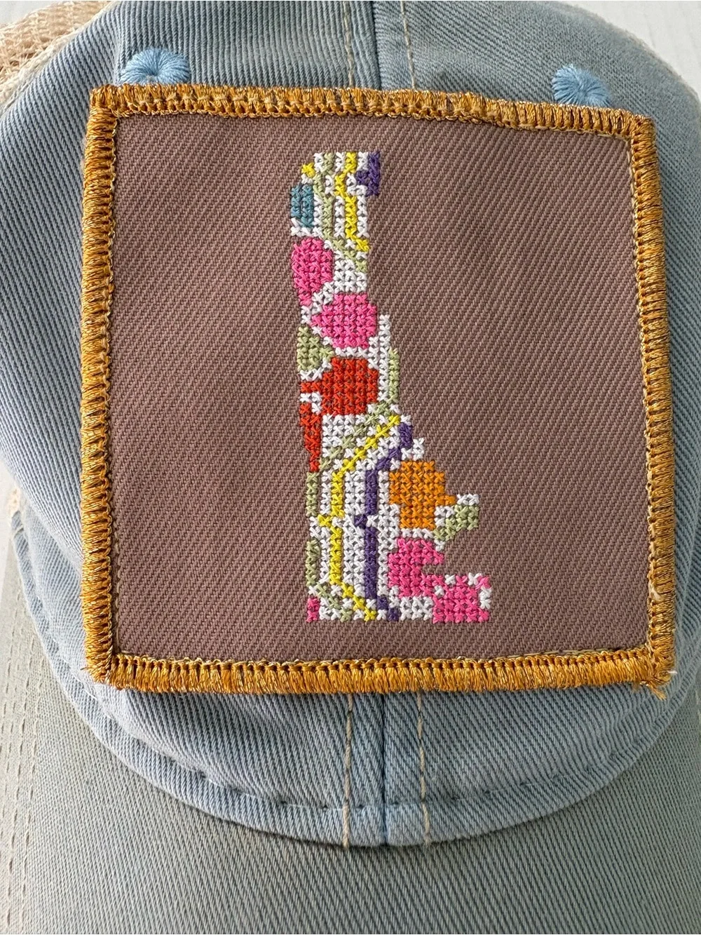 Judith March Distressed Trucker Hat state Delaware embroidery Patch blue tan